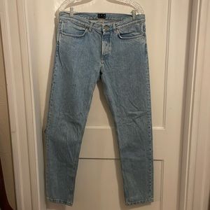 Men's ASKET button front stone bleached wash jeans.